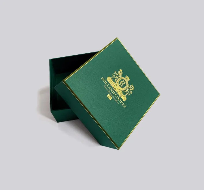 Holland Cooper textured card rigid box with gold foil design.