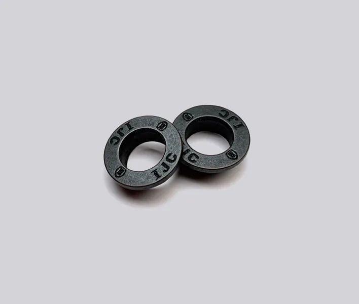 Die-cast alloy branded garment eyelet.