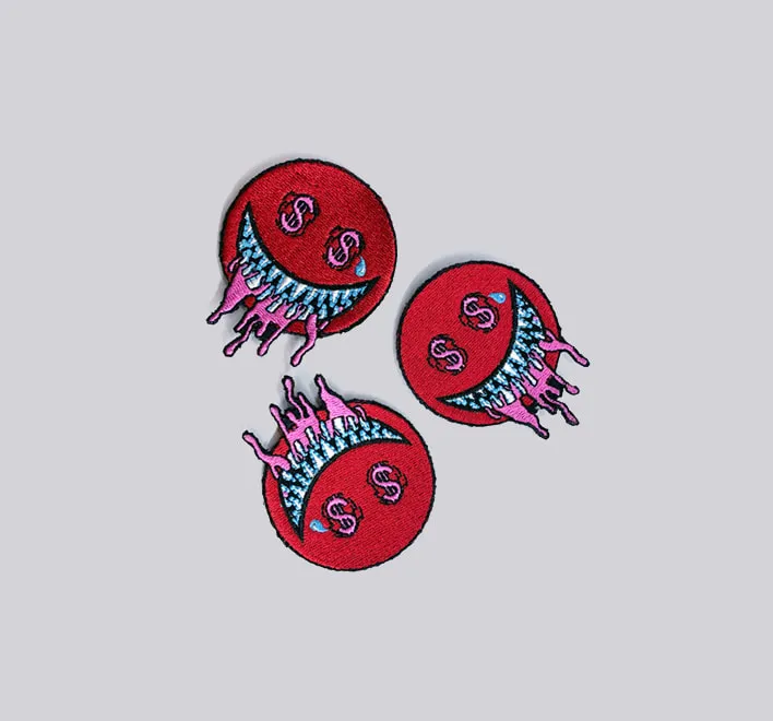 Personalised embroidered clothing badges.