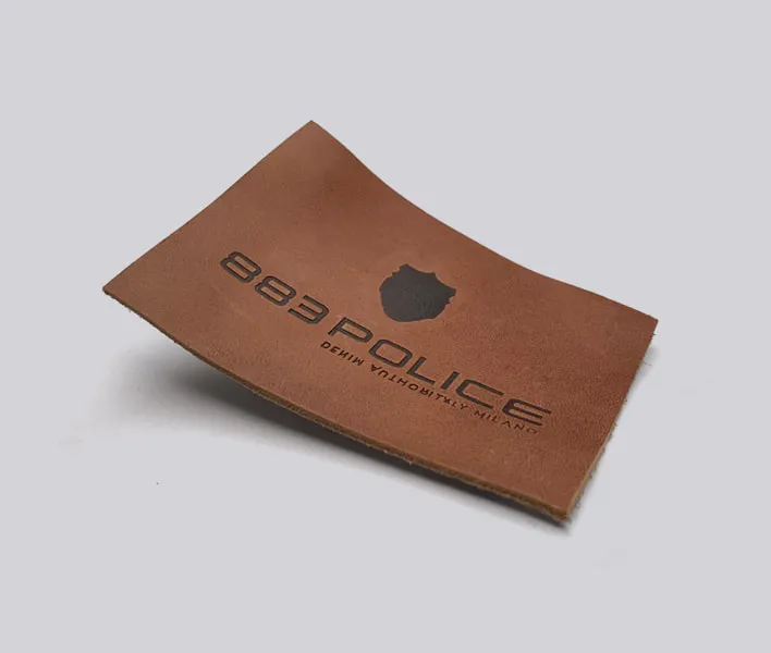 883 Police hot stamped jeans leather label.