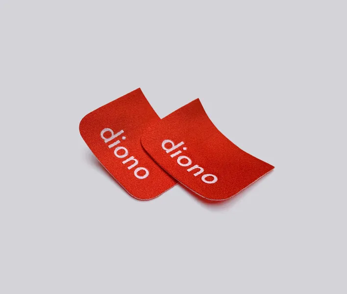 Laser cut woven label for apparel.